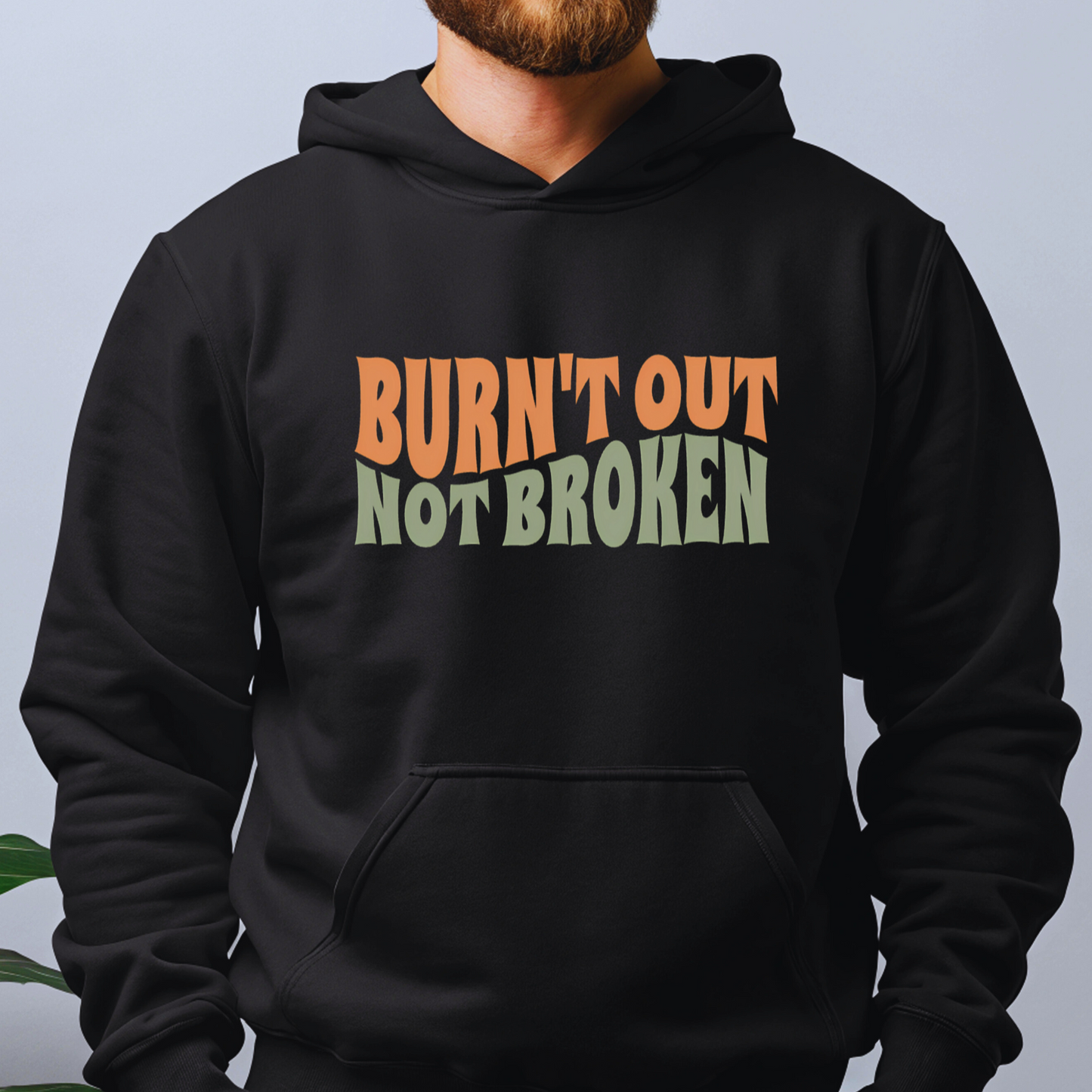 Black hoodie with Burnt Out Not Broken quote in retro wavy font